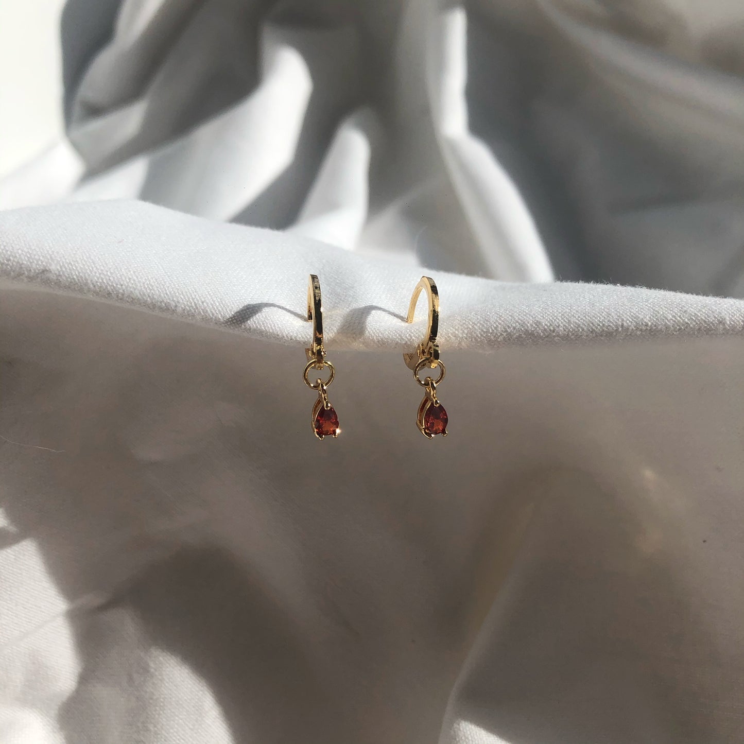 Amber Ruby Huggie Earrings