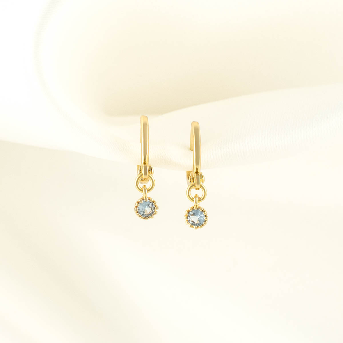 Daphne Blue Zircon Huggie Earrings