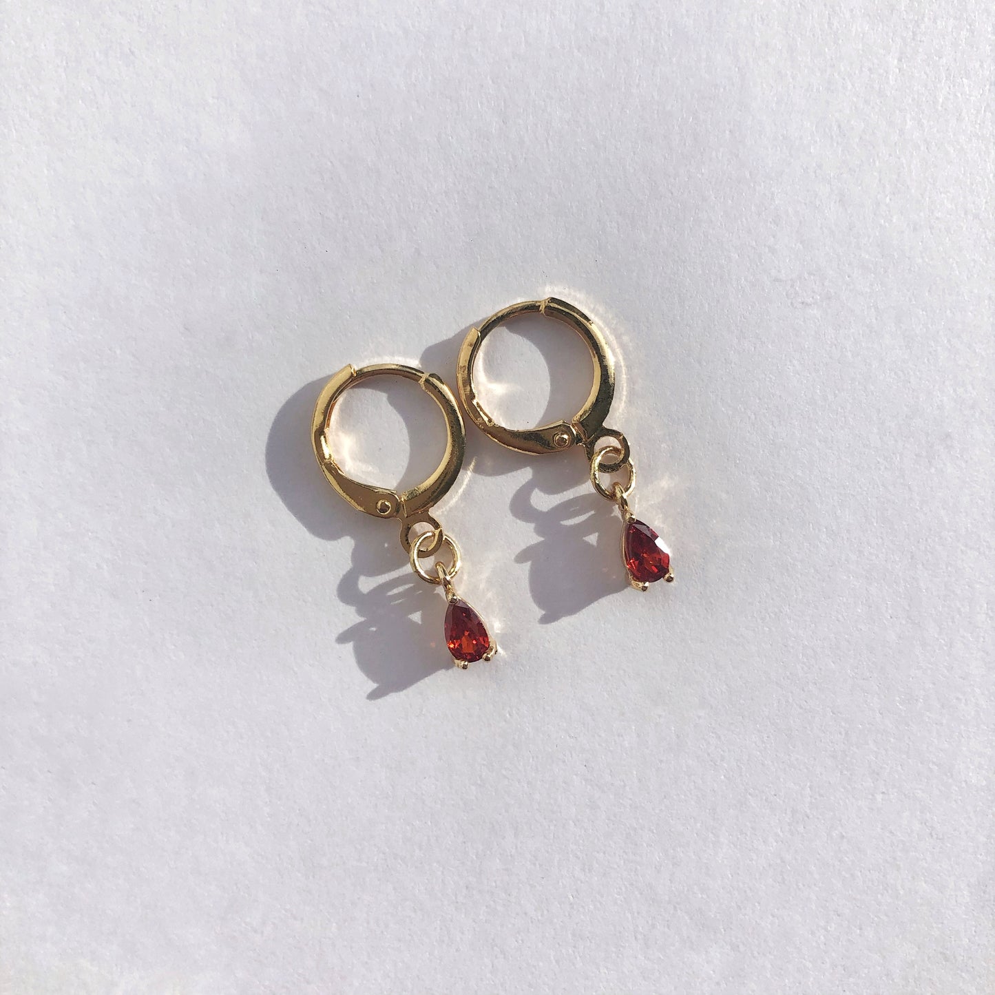 Amber Ruby Huggie Earrings